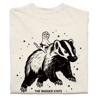 A folded ivory heavyweight t-shirt with a black ink graphic of a cat wearing a cheese hat riding a giant badger above the text "The Badger State"