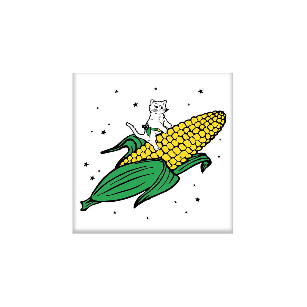 White square magnet with an illustration of a cat with a RAYGUN holstered riding a giant ear of corn through the sky.