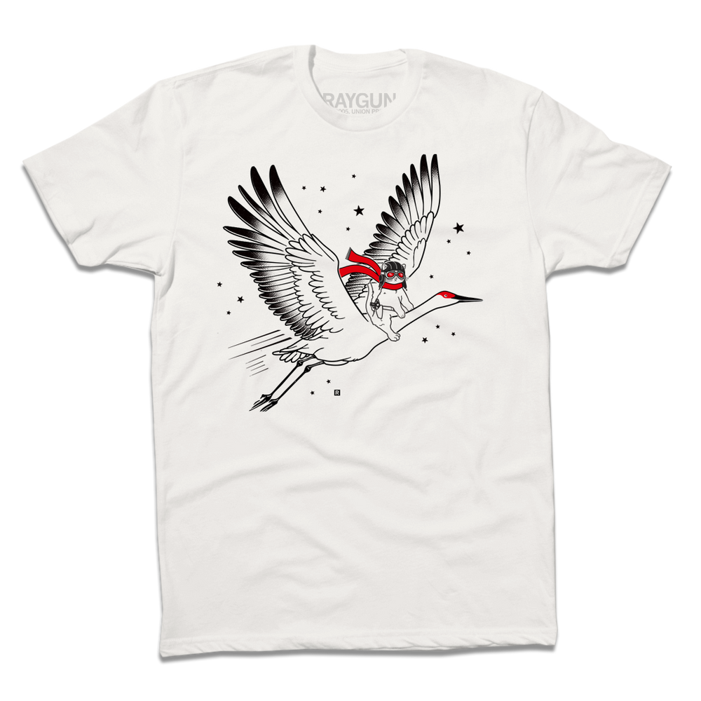 A Next Level Bone t-shirt with black and bright red ink depicting RAYGUN's cat mascot riding a giant crane through the sky while wearing a pilot helmet and a scarf.
