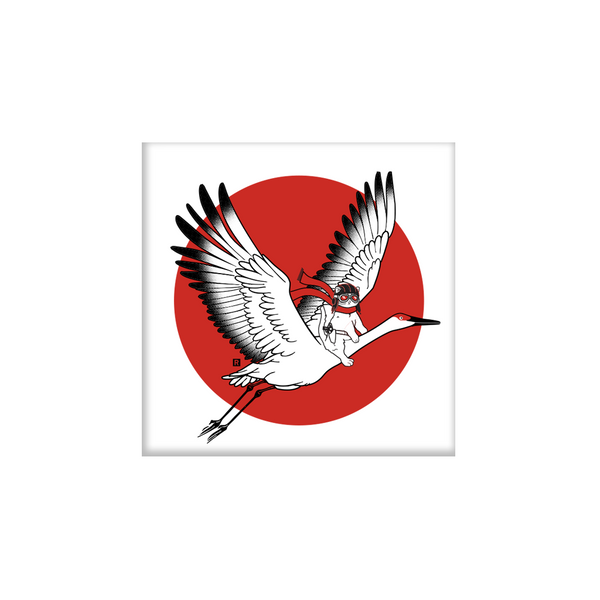 Square white magnet with a centered red circle. Illustrated in front of that circle is a cat with an old timey pilot hat and google riding a crane.