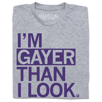 A heather grey t-shirt with left aligned purple ink that reads "I'm gayer than I look."