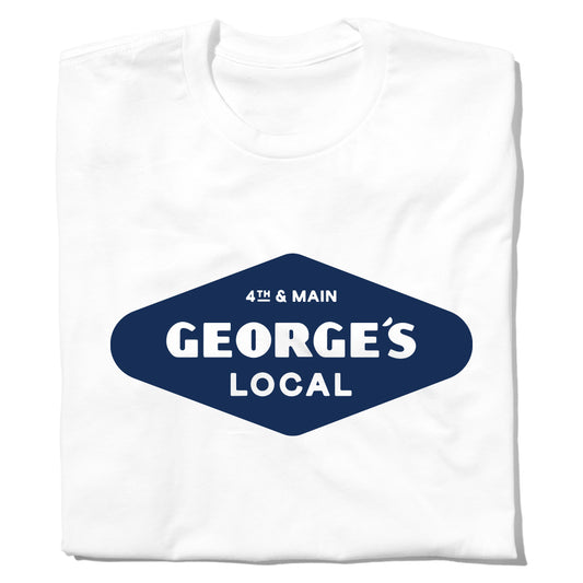 White crew neck union-made t-shirt featuring a blue diamond-shaped graphic that reads 4th & Main GEORGES LOCAL from Cedar Falls, Iowa.