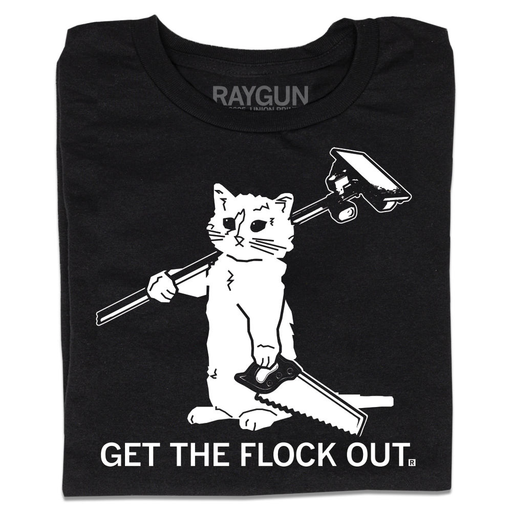 A folded black t-shirt with white print depicting a cat holding a Flock camera of its shoulder and holding a saw in its hand. All caps text at the bottom reads "Get The Flock Out."