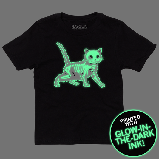 Black Gary Bones t-shirt featuring a glowing green cat skeleton graphic and a circular badge stating the design is printed with glow-in-the-dark ink.