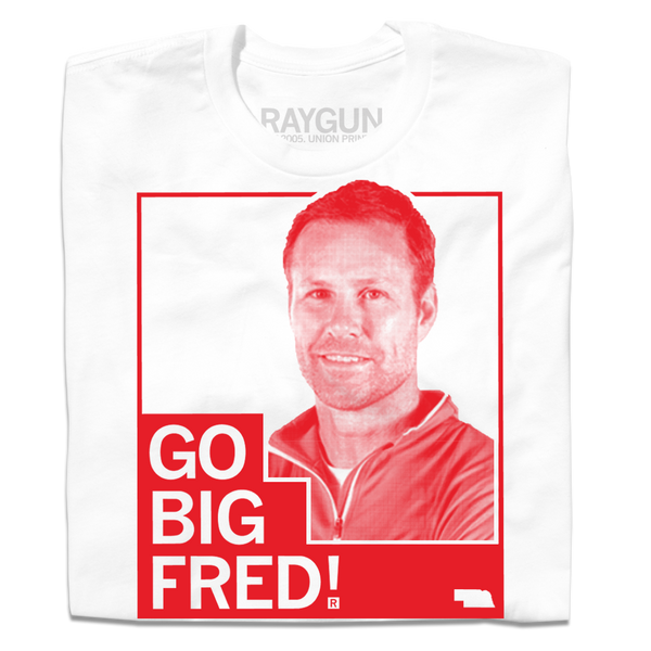 A folded white t-shirt with red ink depicting a shaded pictured of Fred Hoiberg with the text 
