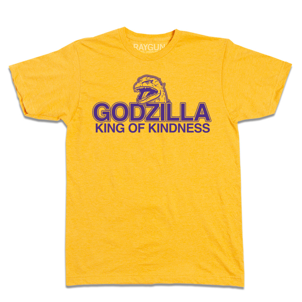 Heather mellow yellow t-shirt with purple ink that says, "Godzilla King of Kindness" with Godzilla's head emerging above the text.