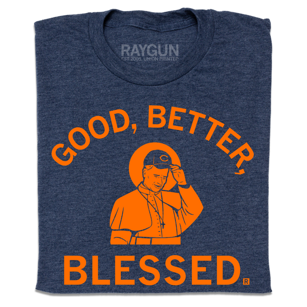 A folded heather navy t-shirt with orange print. Curved text at the top says, 
