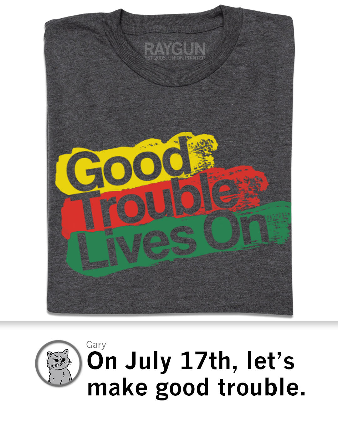 A charcoal gray Good Trouble T-shirt with the text Good Trouble Lives On printed in yellow, red, and green paint-stroke style blocks.