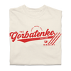 Red script text on an ivory comfort colors shirt that says, "The Gorbatenko Sissters. Nicole, Rachel, Kelly" with three hockey sticks and a puck.