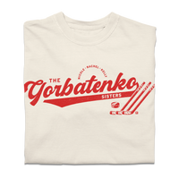 Red script text on an ivory comfort colors shirt that says, "The Gorbatenko Sissters. Nicole, Rachel, Kelly" with three hockey sticks and a puck.