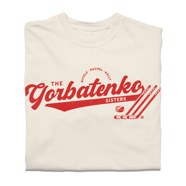 Red script text on an ivory comfort colors shirt that says, 