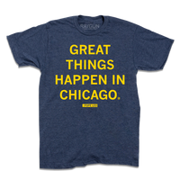 Short-sleeve heather denim shirt with bright yellow text that says, "GREAT THINGS HAPPEN IN CHICAGO" with "-Pope Leo" beneath in smaller text.