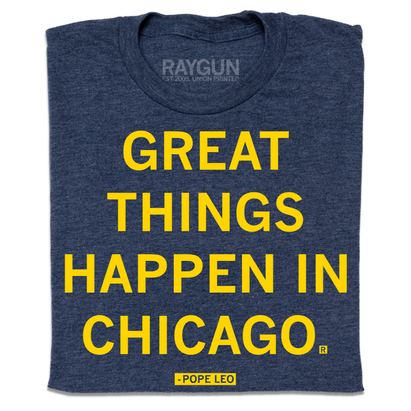 A folded heather navy t-shirt with centered yellow ink text that says, 