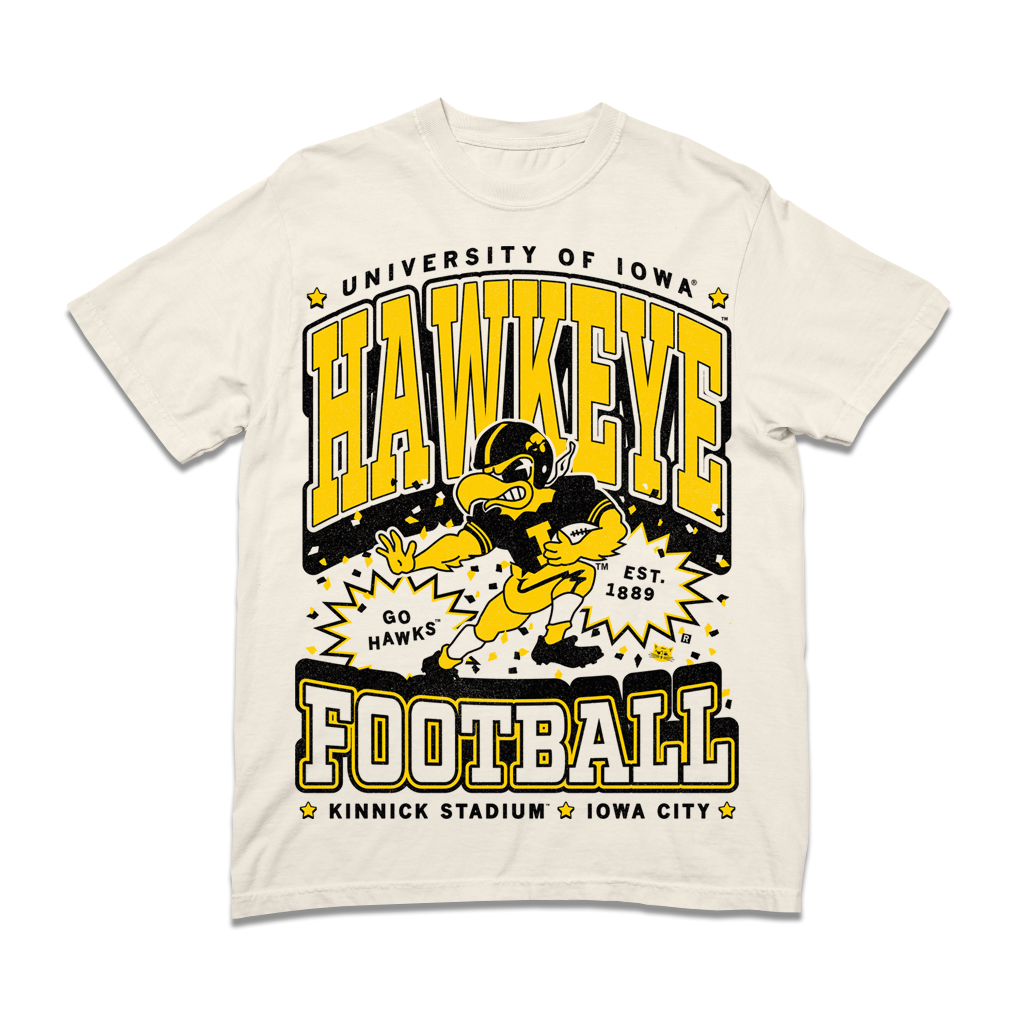 Heavyweight ivory t-shirt featuring University of Iowa Hawkeye football graphics, including a mascot illustration, EST. 1889, and Kinnick Stadium Iowa City text.