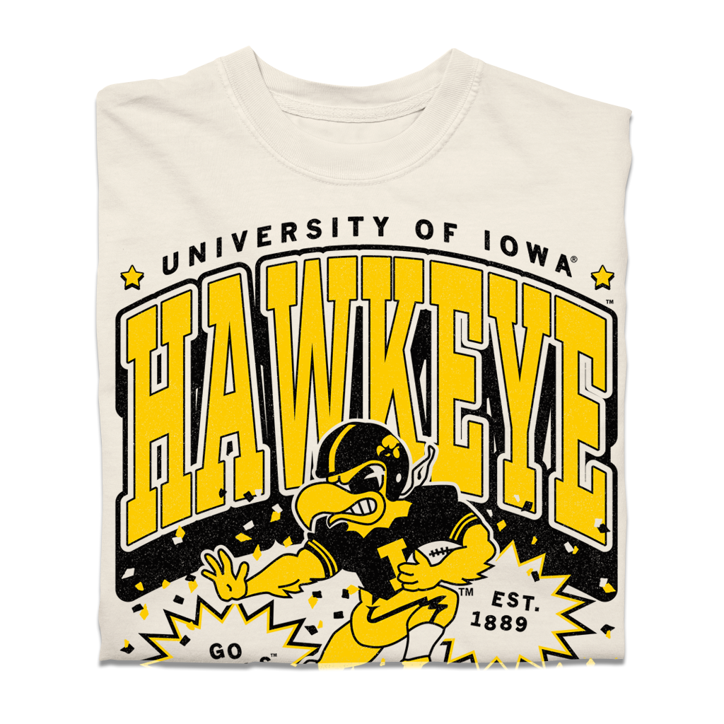 Heavyweight ivory t-shirt with a University of Iowa Hawkeye graphic featuring a mascot running with a football and the text EST. 1889.