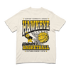 Comfort colors heavyweight ivory t-shirt with Gold & Black ink. From top to bottom it reads "Carver-Hawkeye Arena. Hawkeye Women's Basketball. Established 1974." An illustration of Herky the Hawk beside a basketball in the net are in the center of the shirt.