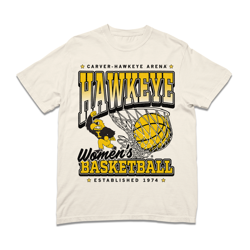 Comfort colors heavyweight ivory t-shirt with Gold & Black ink. From top to bottom it reads "Carver-Hawkeye Arena. Hawkeye Women's Basketball. Established 1974." An illustration of Herky the Hawk beside a basketball in the net are in the center of the shirt.