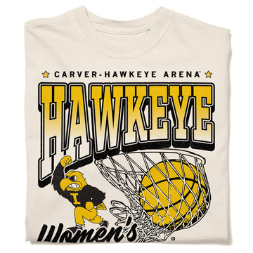 A folded ivory heavyweight t-shirt with Gold & Black ink. From top to bottom it reads "Carver-Hawkeye Arena. Hawkeye Women's Basketball. Established 1974." Herky the Hawk and a basketball in the net are in the center of the shirt.