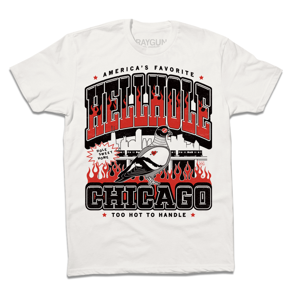 A white short-sleeve crewneck t-shirt featuring a bold graphic print on the front. The design displays 'HELLHOLE CHICAGO' in large black and red letters, with a cartoon pigeon, flames, and a Chicago skyline silhouette in the center.