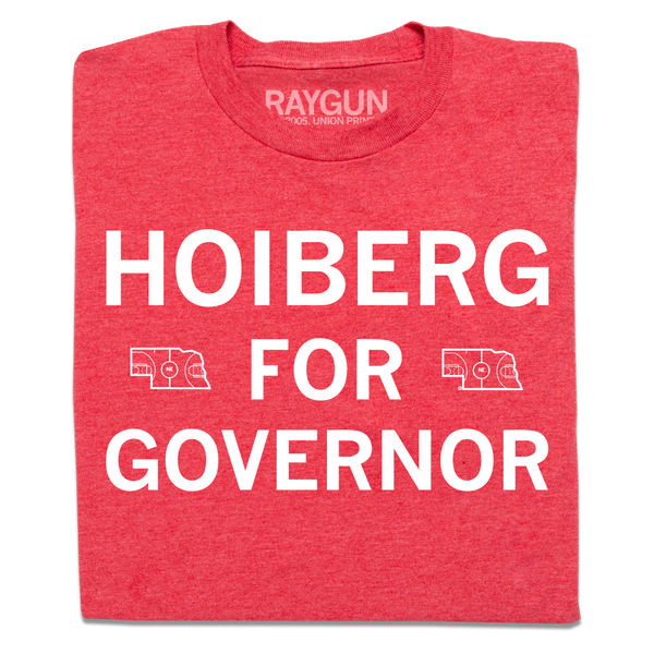 A folded heather red t-shirt with centered white ink text that says, 