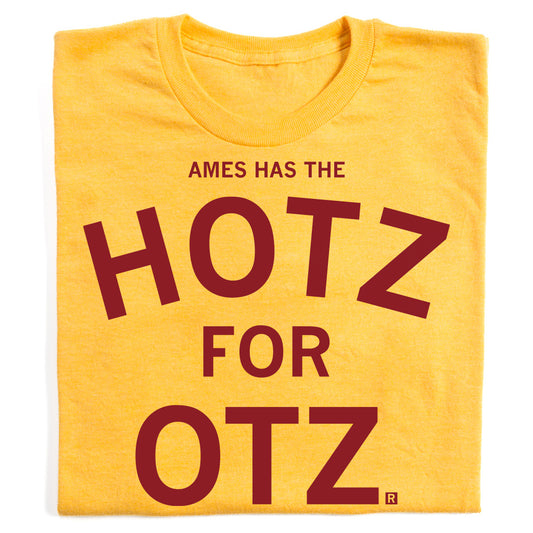 Mellow yellow t-shirt featuring the brown text AMES HAS THE HOTZ FOR OTZ.