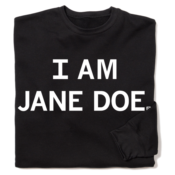 A folded black crewneck sweatshirt with centered white ink text that reads 