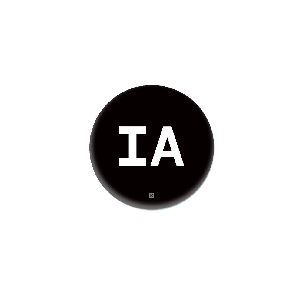 A black circular Iowa button containing the white letters IA with a small registration symbol below them.