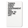 A white RAYGUN notebook cover featuring the black text: THINGS IOWAS STATE GOVERNMENT HAS DONE TO PISS ME OFF.
