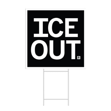 A square black yard sign with a white border and white text that says, "ICE OUT"