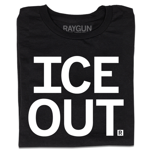 A folded black t-shirt with large white text on two lines that says, " ICE OUT"