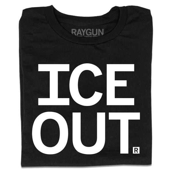 A folded black t-shirt with large white text on two lines that says, 