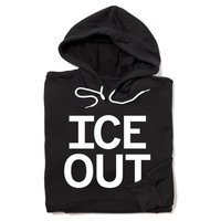A folded black hoodie with large white print that says, "ICE OUT"