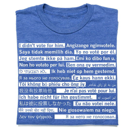 Heather royal blue t-shirt printed with the phrase I didn’t vote for him repeated in many different languages inside a white rectangular box.