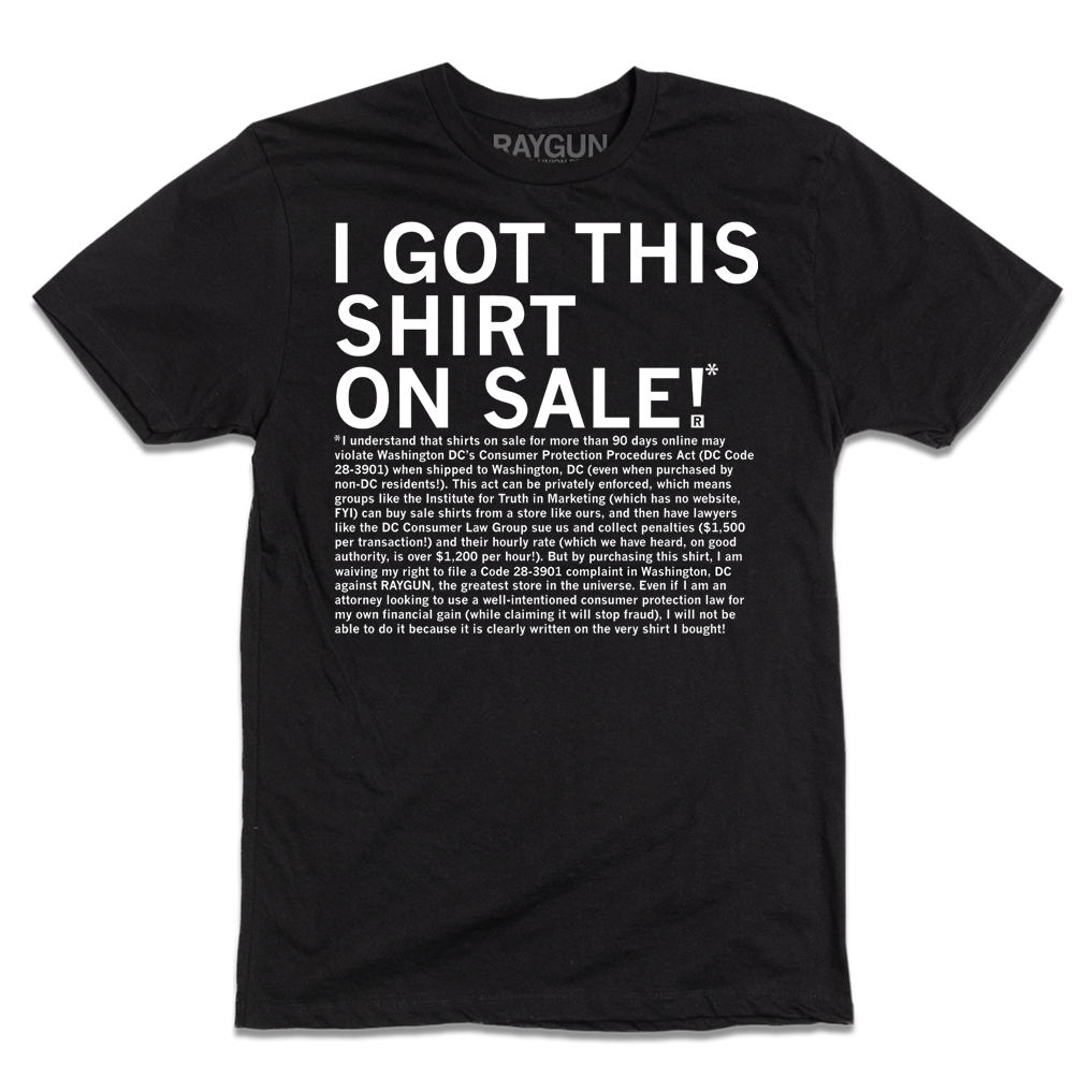 A black, union-labor T-shirt printed with the white text I GOT THIS SHIRT ON SALE! followed by a long paragraph of legal disclaimer text regarding Washington DC consumer protection laws.