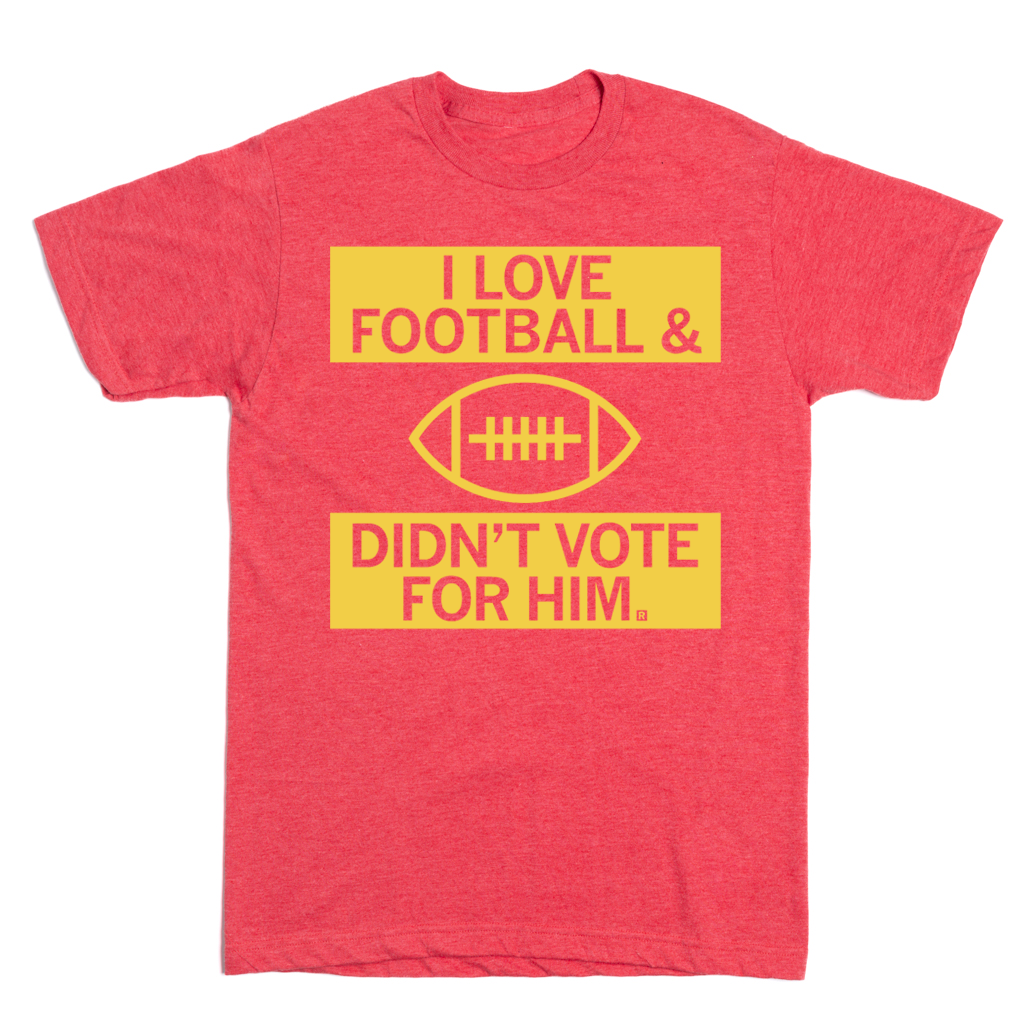 Red football t-shirt featuring yellow text that reads I LOVE FOOTBALL above a ball icon, with DIDNT VOTE FOR HIM below it.