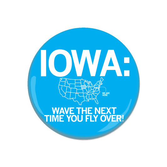 Blue RAYGUN metal button that reads IOWA: WAVE THE NEXT TIME YOU FLY OVER! and features an outline of the United States with Iowa highlighted.