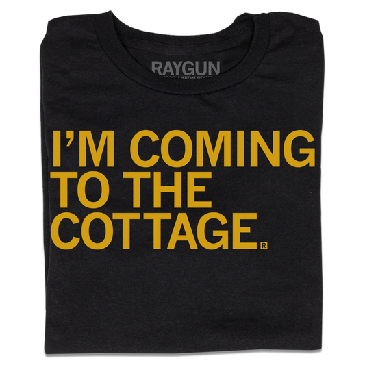 Black t-shirt with left-aligned gold ink text that says, "I'm Coming To The Cottage"