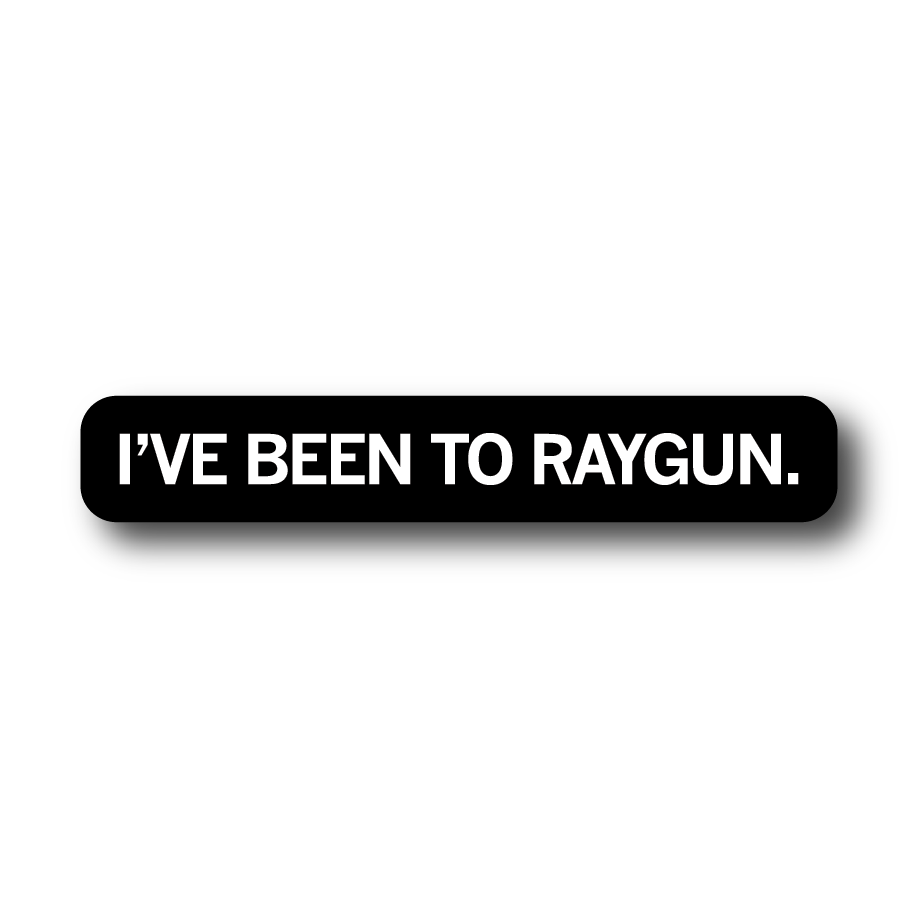 A black, rectangular RAYGUN vinyl sticker with white text that reads, IVE BEEN TO RAYGUN.
