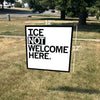 A 12x12 inch RAYGUN yard sign on a lawn that reads ICE NOT WELCOME HERE, with white arrows indicating the dimensions.