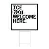 A square white yard sign with a black border and left-aligned black text that reads "ICE NOT WELCOME HERE"