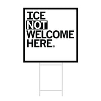 A square white yard sign with a black border and left-aligned black text that reads "ICE NOT WELCOME HERE"