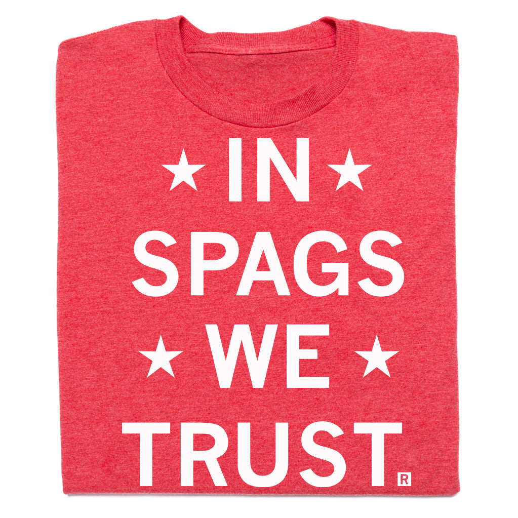 Red RAYGUN t-shirt with the white text IN SPAGS WE TRUST surrounded by four stars.