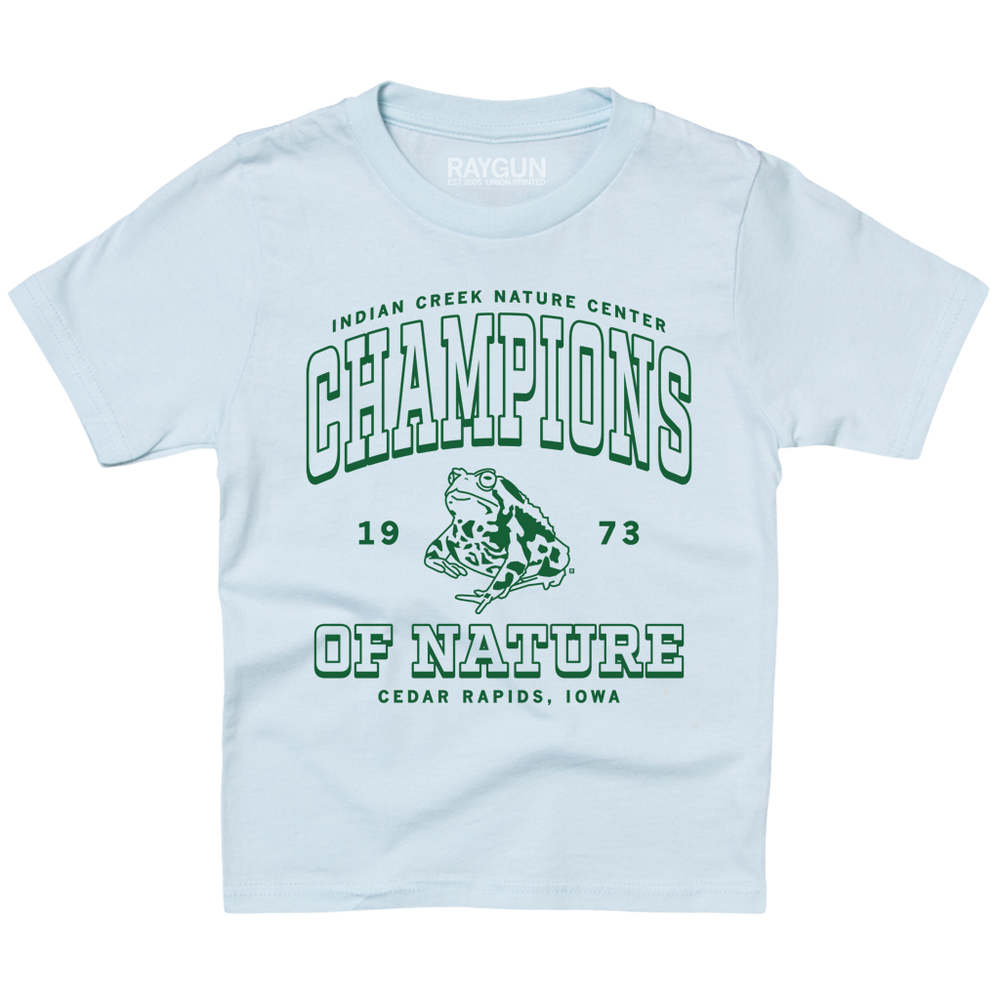Ice blue youth t-shirt with kelly green ink that says, "Indian Creek Nature Center: Champions of Nature since 1973. Cedar Rapids, Iowa" with an illustration of a toad in the center.