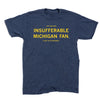 A navy blue RAYGUN t-shirt with yellow text that reads JUST ANOTHER INSUFFERABLE MICHIGAN FAN. IT WAS US VS EVERYBODY.