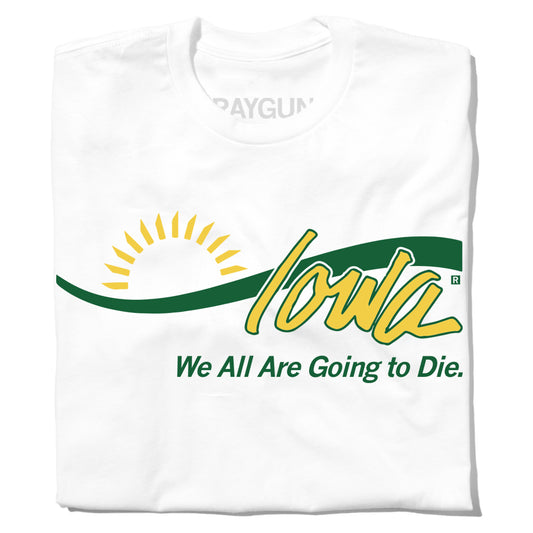 A folded white t-shirt with yellow and green ink laid out like the welcome to Iowa sign with Joni Ernst's quote "We all are going to die" below.