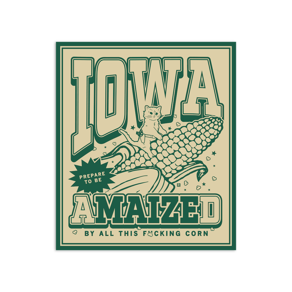 RAYGUN vinyl sticker reading: Iowa: Prepare to be amaized by all this fucking corn, featuring a small cat sitting on a large ear of corn.