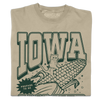 Tan garment-dyed t-shirt featuring a dark green graphic of a cat riding a giant ear of Iowa corn with the text IOWA and PREPARE TO BE.