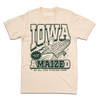 Cream t-shirt with dark green ink that says, "Iowa: Prepare to be aMAIZEd by all this f*cking corn" along with an illustration of a cat riding a giant ear of corn.
