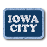 A vintage style, faded rectangle sticker with a blue background, pastel blue border, and white text that say, "IOWA CITY."
