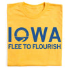 Union made yellow t-shirt with the word IOWA printed in blue, featuring a stylized sun and river graphic in place of the O, and the text FLEE TO FLOURISH underneath.